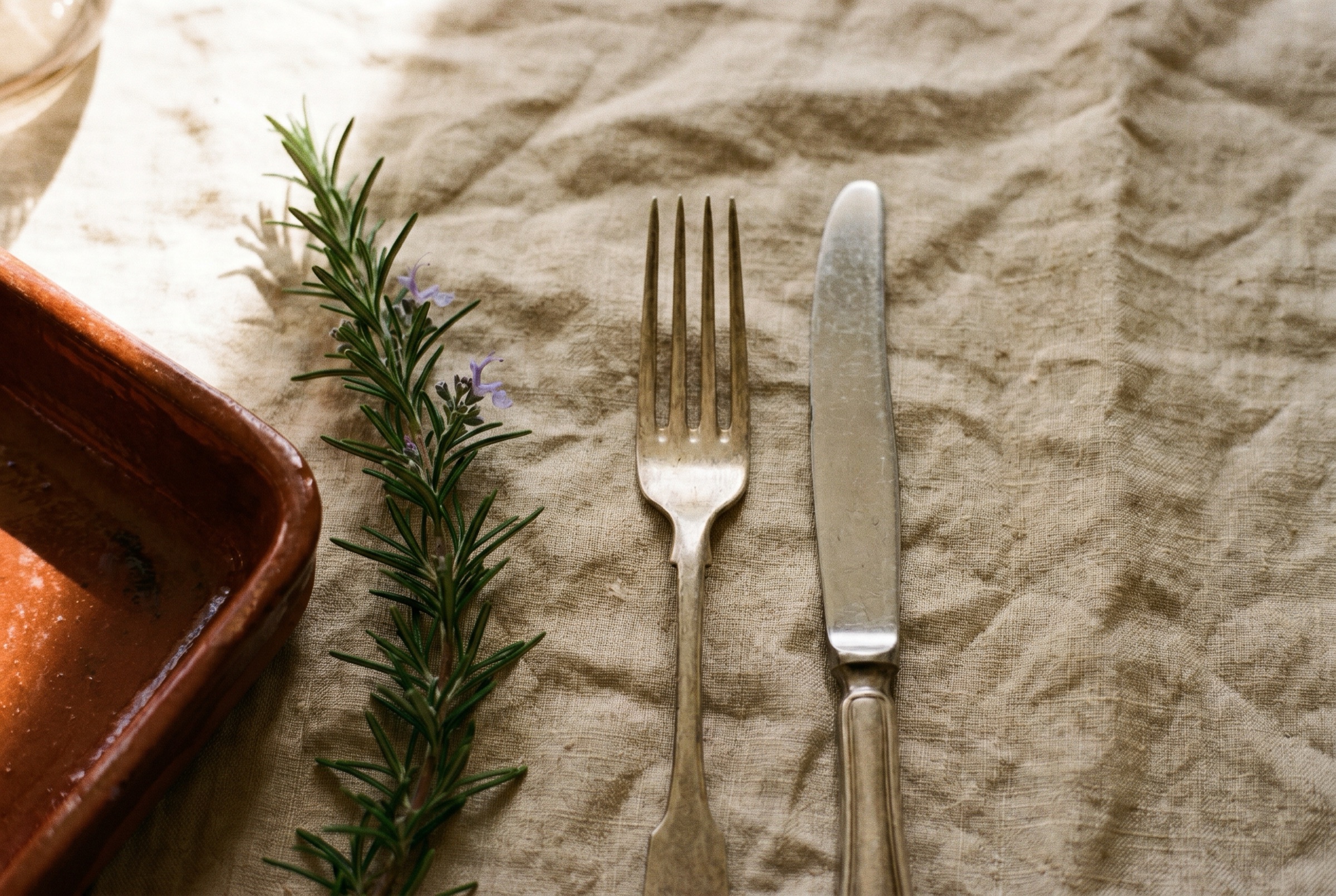Silver flatware on linen — Albanian fine dining