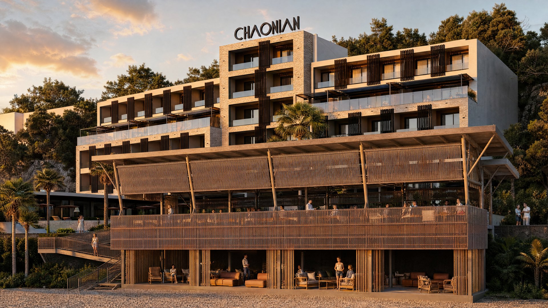 Chaonian Hotel — beach-side exterior at golden hour, with the elevated bar terrace and lower lounge