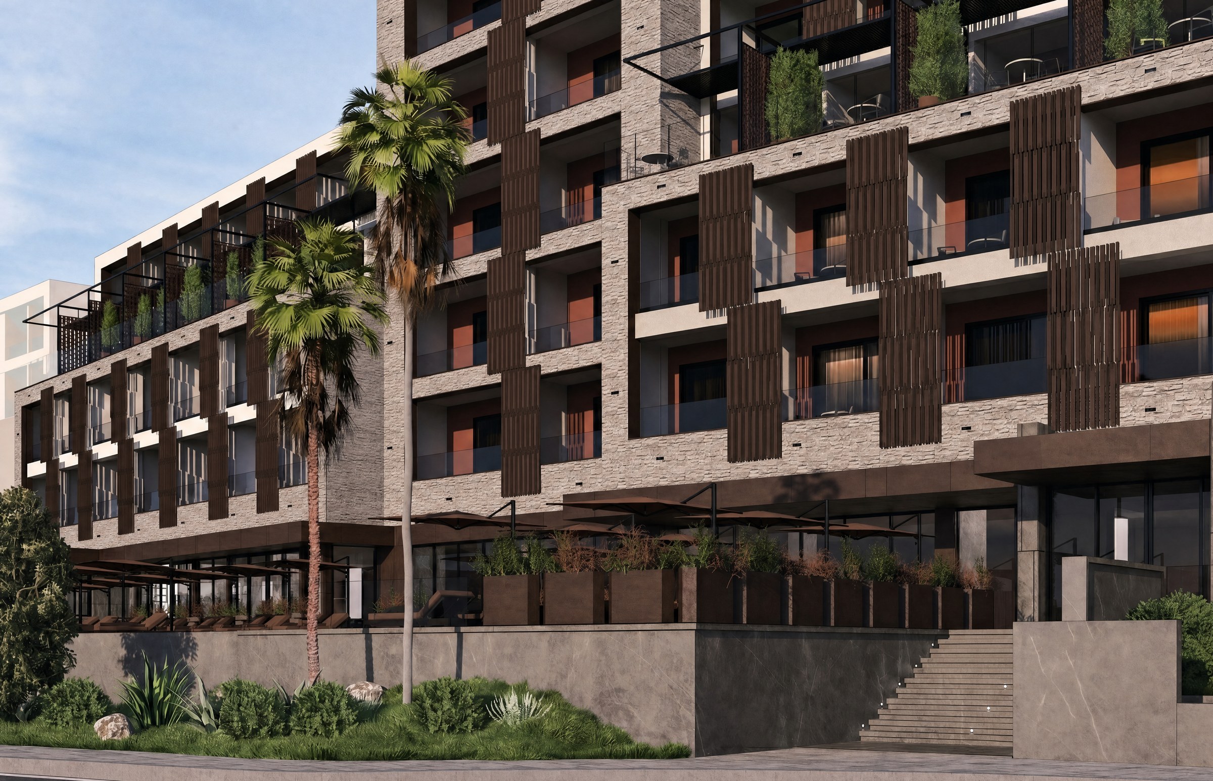Chaonian Hotel — facade and entrance stair among the palms