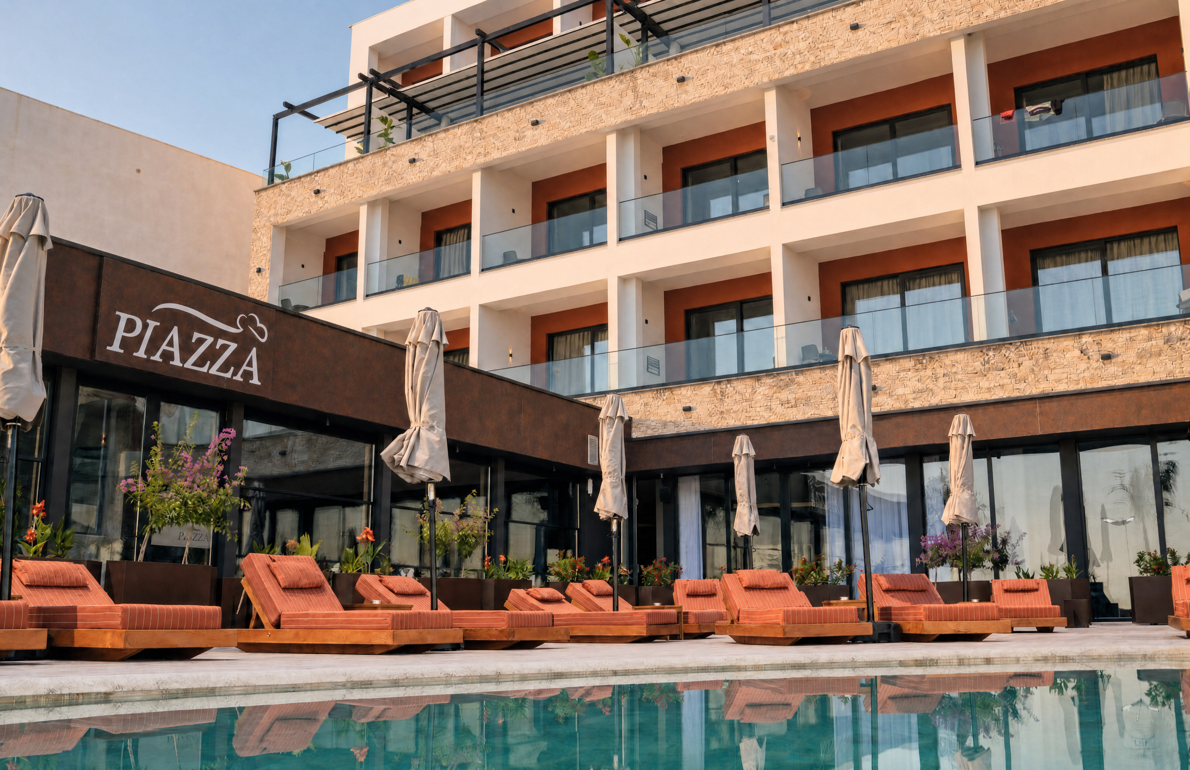 Chaonian Hotel — the pool terrace below the guest balconies, Piazza alongside