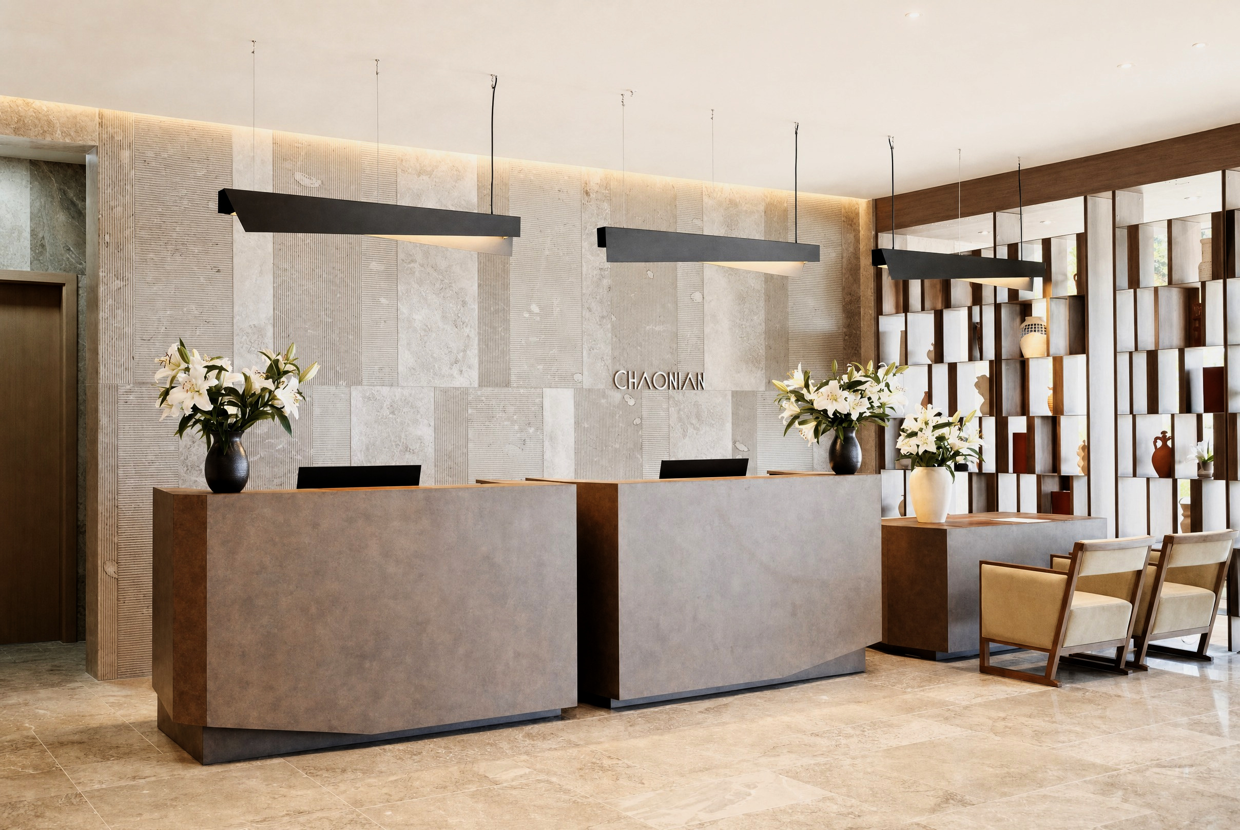 Reception lobby — twin travertine desks beneath the bronze Chaonian wordmark